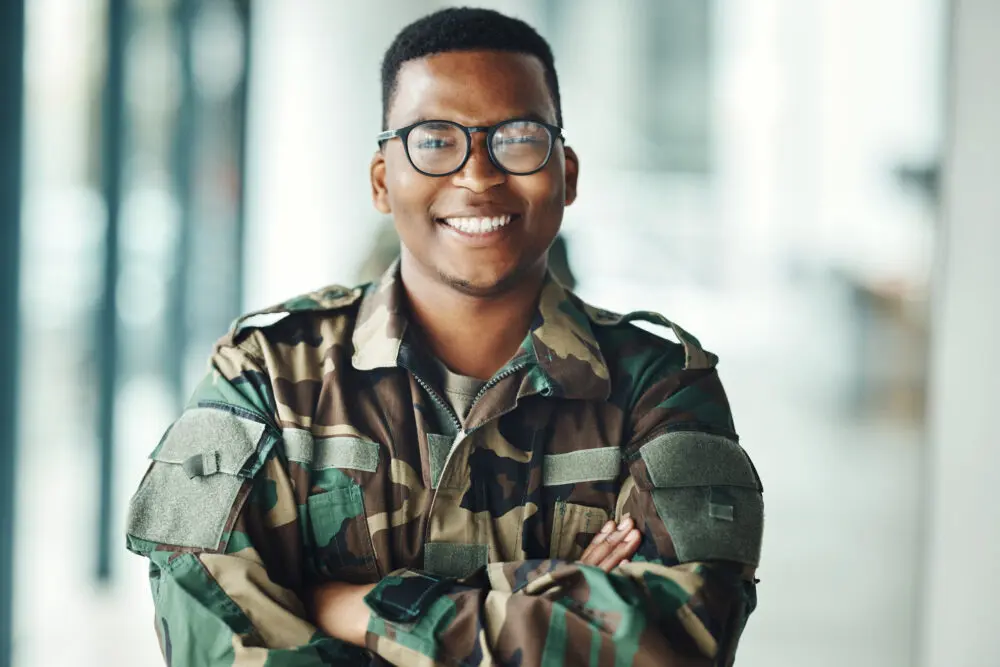 man in camo uniform smiling | Government agencies hiring