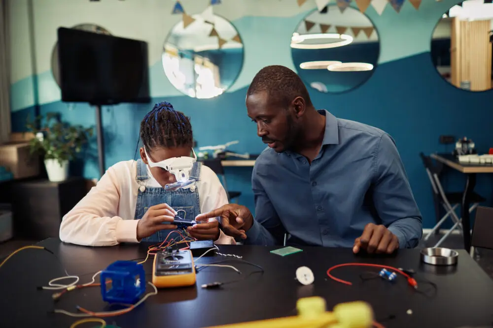 black girl building a robot in a STEM class | Cincinnati youth education programs