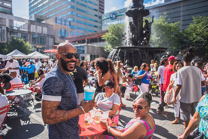 Smiling man enjoying the Cincinnati music festival activities at fountain square